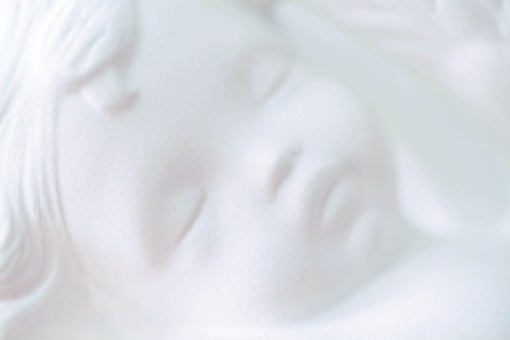 Close up of face of beautiful angel ornament with cherubic face