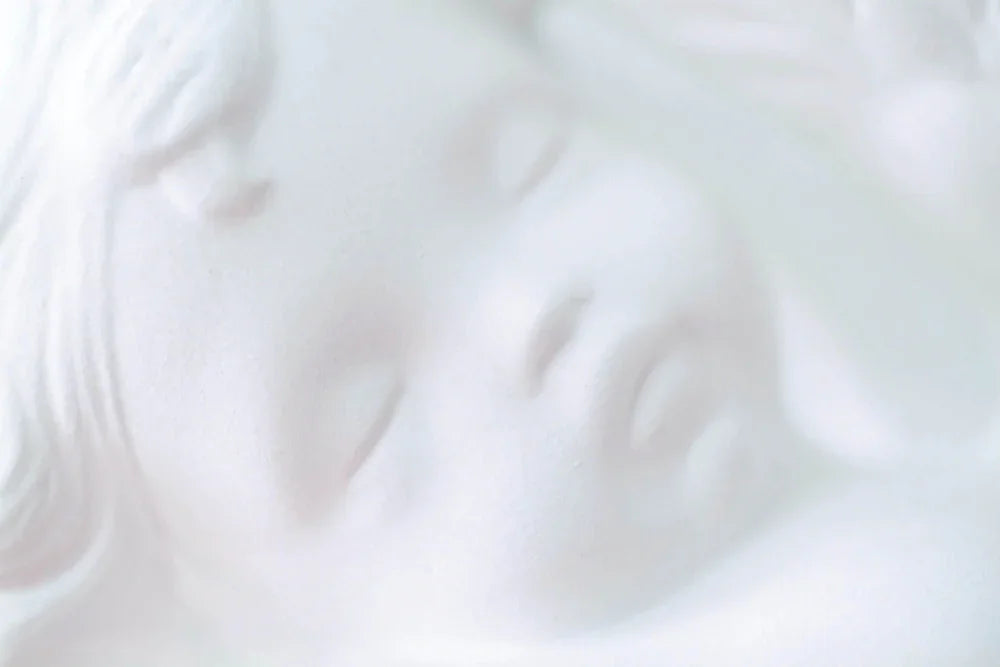 Close up of face of beautiful angel ornament with cherubic face
