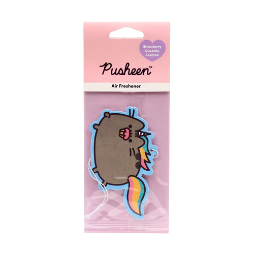 Front view of a Pusheen the Cat Pusheenicorn air freshener in its clear retail packaging. The pink header card displays 'Pusheen' and 'Air Freshener' text, plus a purple heart indicating 'Strawberry Cupcake Scented'. The grey cat-shaped air freshener itself features a pink cupcake on its head, a colourful horn, and a rainbow tail, with a white string attached.