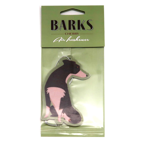 Front view of a packaged cherry-scented air freshener shaped like a black and light brown dog, with 'BARKS' branding on the green header.
