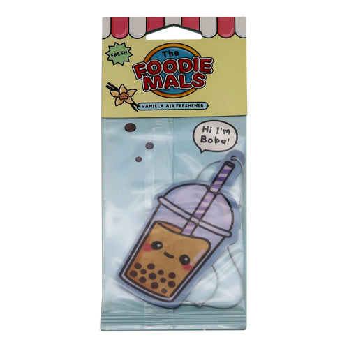 Front view of a vanilla air freshener in retail packaging, shaped like a cartoon boba tea cup with a smiling face, brown pearls, and a purple striped straw. The yellow packaging header features 'VANILLA AIR FRESHENER' text, a vanilla flower graphic, and a speech bubble reading 'Hi I’m Boba!'.