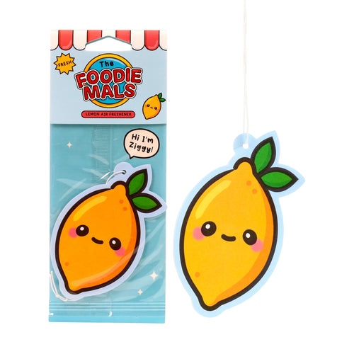Angled view of two lemon-shaped air fresheners on a white background. One is sealed in clear packaging with a light blue top, featuring a red and white striped awning design and 'The Foodiemals' and 'Hi I'm Ziggy!' text. The second, identical air freshener is unpackaged, revealing its yellow lemon design with green leaves, cute black eyes, curved mouth, pink cheeks, and a light blue border, with a white hanging string.