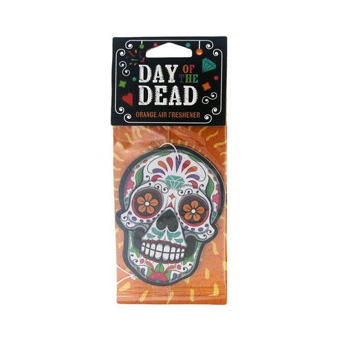 Front view of a Day of the Dead sugar skull air freshener in clear packaging. It features colourful orange-flowered eyes, green, red, and purple patterns, with a black header and an orange background.