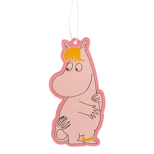 A pale pink Moomin Snorkmaiden air freshener, shaped as the character with yellow hair, a red outline, arms crossed, a yellow ankle band, and a white string for hanging.