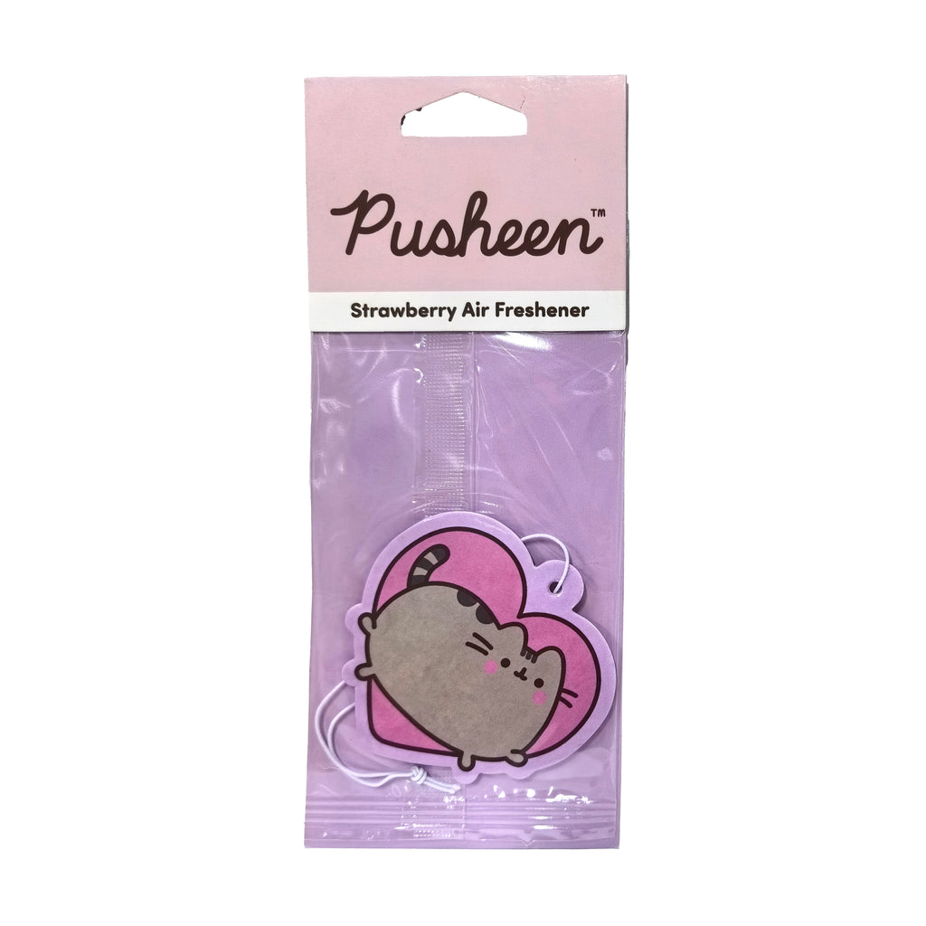 Front view of a strawberry-scented Pusheen the Cat air freshener, shaped like a pink heart with a grey cat design, displayed in clear plastic packaging with a pink cardboard header and a white hanging string.