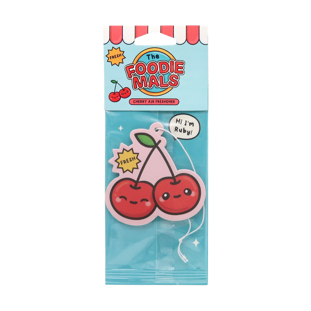 Front view of a Cherry Foodiemals air freshener in its light blue packaging. The air freshener features two red cartoon cherries with faces, a pink stem, and green leaves, with a 'Hi I'm Ruby!' speech bubble.