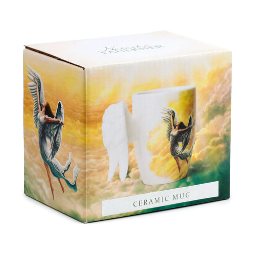 Angled view of angel wings ceramic mug packaging, illustrating the white mug with a shaped wing handle and an angel decal against a cloudy sky background.