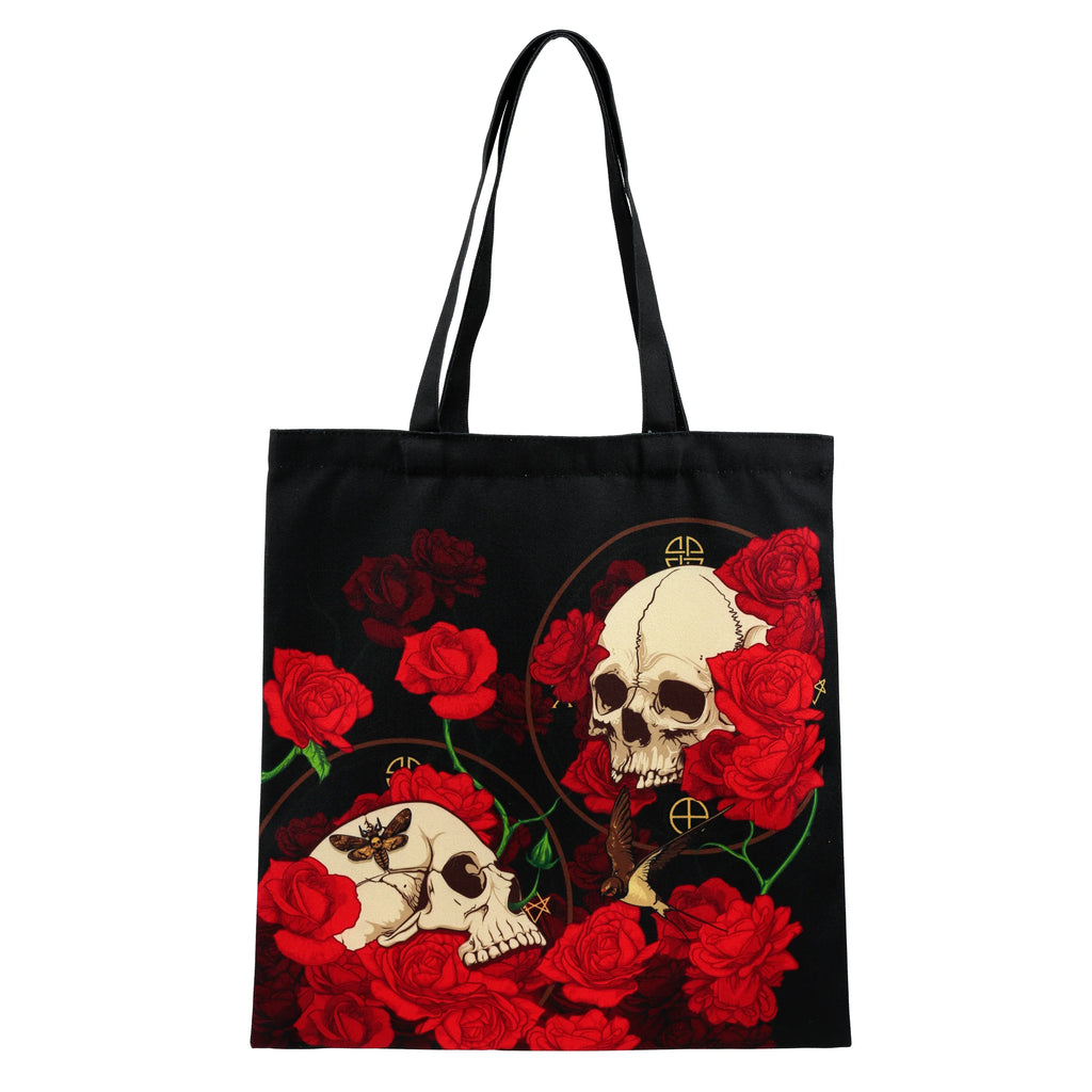 Front view of a black reusable tote shopping bag, featuring a bold design of red roses and two light-coloured skulls.