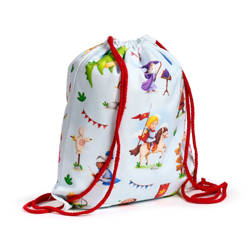 Angled view of a light blue canvas drawstring bag featuring a colourful knights, dragons, and wizard print with red drawstrings.