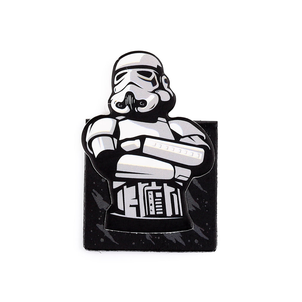 Front view of a magnetic Stormtrooper bookmark, featuring the character's white, black, and grey upper body with arms crossed, and a black rectangular base with subtle grey patterns.