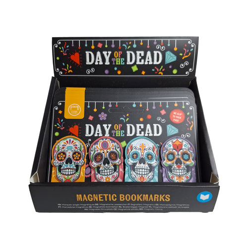Angled view of a Day of the Dead magnetic bookmark set, featuring four colourful sugar skull designs displayed in a black retail box.