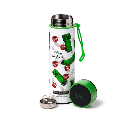 Angled view of a white stainless steel drinks bottle featuring a green Minecraft Creeper, red TNT block pattern, and SSS... BOOM text. Its green digital thermometer lid displaying 55, a separate stainless steel strainer, and a green lanyard are also visible.