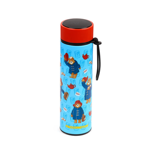 Angled view of a blue insulated drinks bottle with a red digital thermometer lid, patterned with illustrations of Paddington Bear, marmalade jars, teacups, teapots, and sandwiches, with 'PADDINGTON' written at the base.