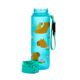 Angled view showing a translucent blue water bottle featuring multiple capybaras floating with water lilies, one riding on another's back. Its teal pop-top lid is detached and rests beside it, while a teal fabric strap with a black clip hangs from the bottle's neck.