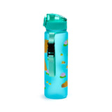 Angled view of an upright 600ml translucent blue pop-top water bottle, featuring a turquoise lid and a light turquoise fabric strap with a black buckle. The bottle is decorated with illustrations of brown capybaras swimming amongst pink lotus flowers and small yellow fruits.
