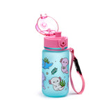 Angled view of a light blue children's water bottle with an open pink pop-top lid and pink strap. The bottle is decorated with a colourful cartoon axolotl, seaweed, and bubble pattern.