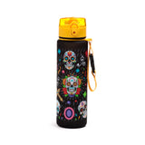 Upright black water bottle with yellow pop-top lid and yellow carry strap, displaying a vibrant Day of the Dead pattern of multiple colourful sugar skulls and flowers.