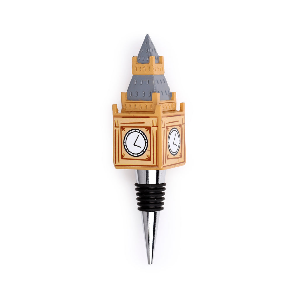 Angled view of a novelty bottle stopper shaped like London's Big Ben clock tower, featuring a beige and grey structure with clock faces, and a silver-coloured stopper with black rubber rings.
