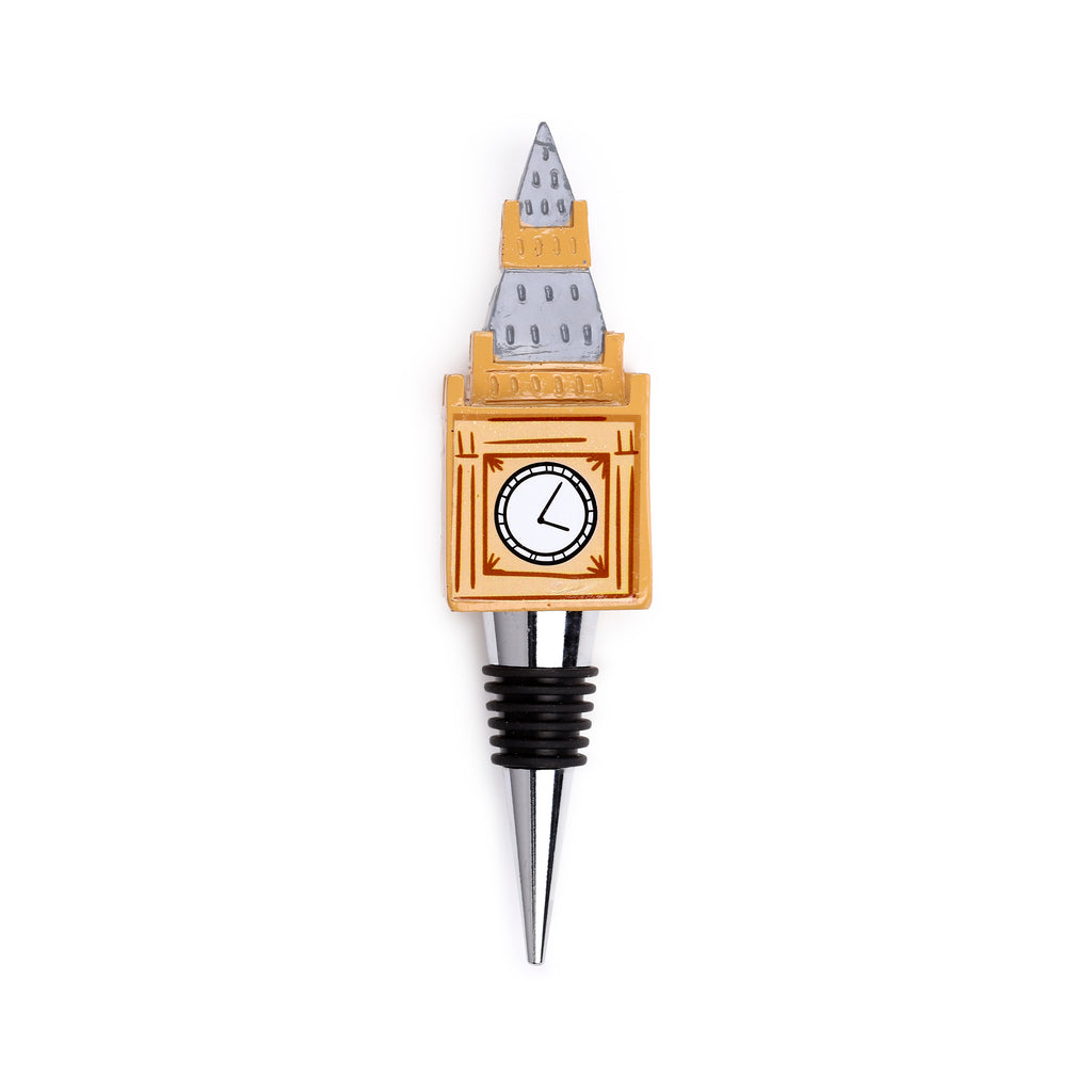 Front view of a novelty bottle stopper featuring a tan and grey Big Ben tower design with a white clock face, attached to a silver-coloured metal stopper with black rubber rings.