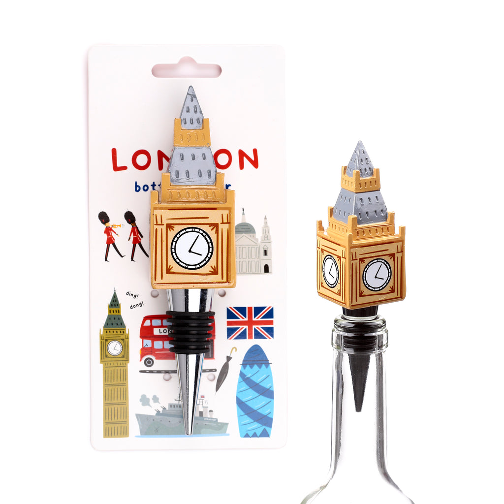 Novelty bottle stopper with a Big Ben replica featuring a golden tower and grey roof, presented on a London icons backing card and separately inserted into a clear glass bottle, against a white background.
