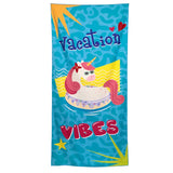 Front view of a blue microfibre beach towel featuring a colourful cartoon unicorn wearing sunglasses, floating on a doughnut ring. The towel also displays 'Vacation' and 'VIBES' text, pink hearts, and yellow sun rays.