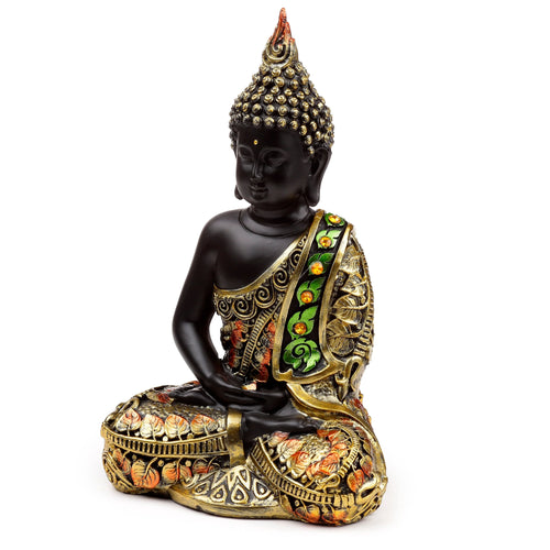 Front view of a decorative black Thai Buddha figurine, seated in contemplation, with ornate gold, orange, and green robes and a patterned base, on a white background.