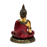 Back view of a red and gold Thai Buddha figurine, depicting coiled hair and an ornate collar, with a draped red robe, seated on a decorative gold base.