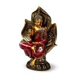 Front view of a Thai Buddha figurine, seated in a lotus position, with gold skin, red and gold patterned robes, and an ornate gold lotus base.