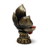 Angled view of a Thai Buddha figurine's ornate gold and black lotus with red colour accents on a white background.