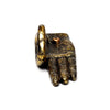 Angled view of a golden-coloured ashcatcher incense stick burner shaped like a Buddha hand, featuring intricate dark henna-style patterns and a central stick holder.