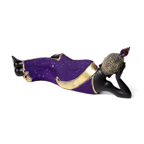 Angled view of a black reclining Buddha figurine adorned in purple robes with gold-effect trim and white speckles, featuring a gold-studded head and purple topknot.