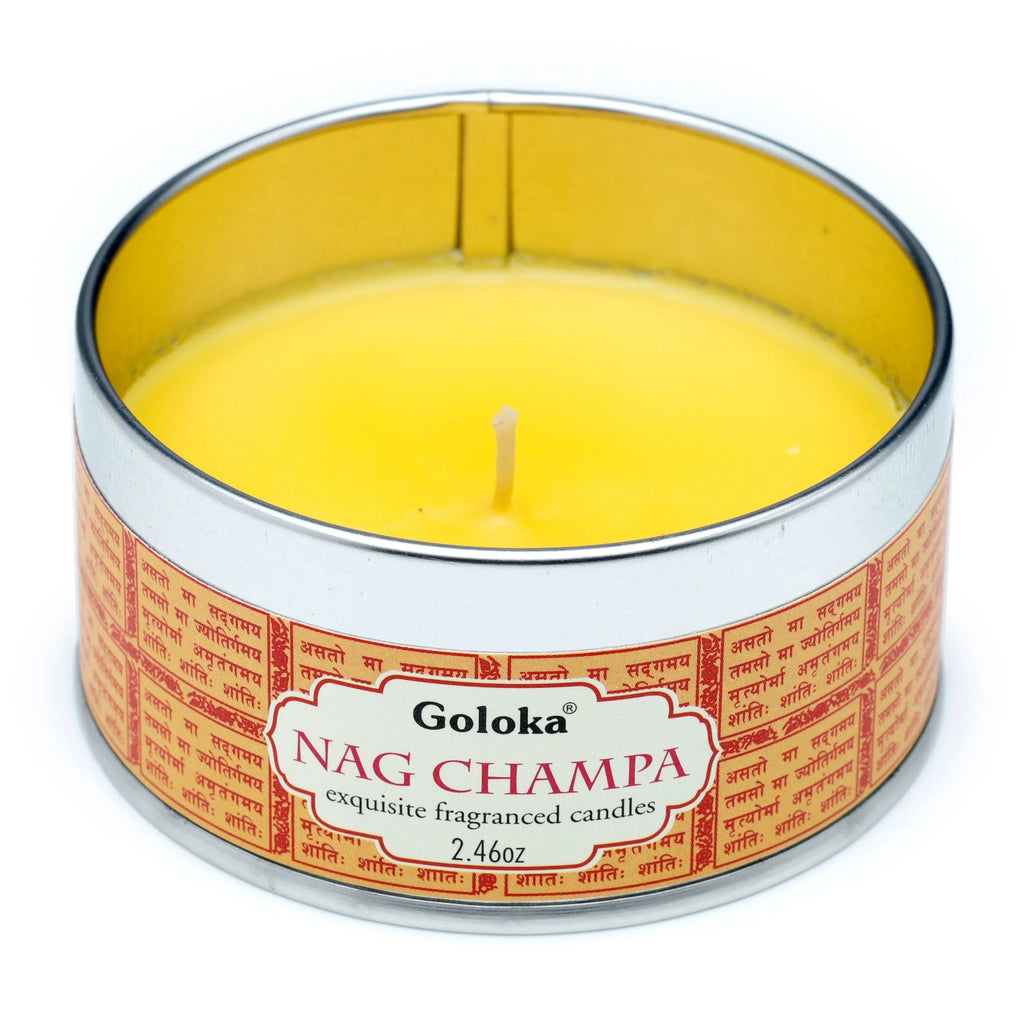 Front view of a round Nag Champa wax candle tin, filled with bright yellow wax and a single wick. The tin features a red and gold label with Goloka Nag Champa text and Sanskrit script.
