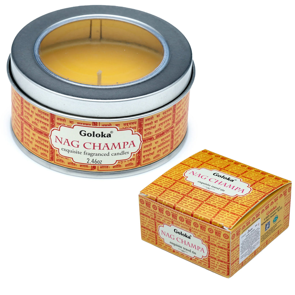 Angled view of a round, silver-coloured Goloka Nag Champa wax candle tin, featuring a clear window lid, yellow wax, and a visible wick. It has a red and yellow label. A matching yellow Goloka Nag Champa cardboard outer box is positioned next to it.