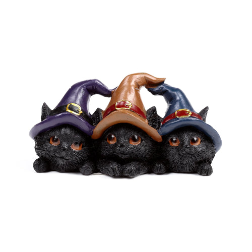 Witches Cat trio ornament: Front view of three black cats with large orange eyes, wearing purple, brown, and blue pointed hats featuring gold buckles.