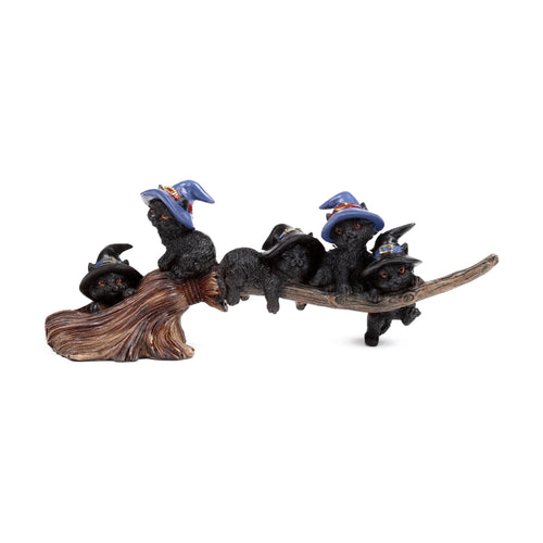 Decorative Witches Cat figurine featuring five black cats wearing witch hats, playing and climbing on a brown broomstick, shown from an angled view.