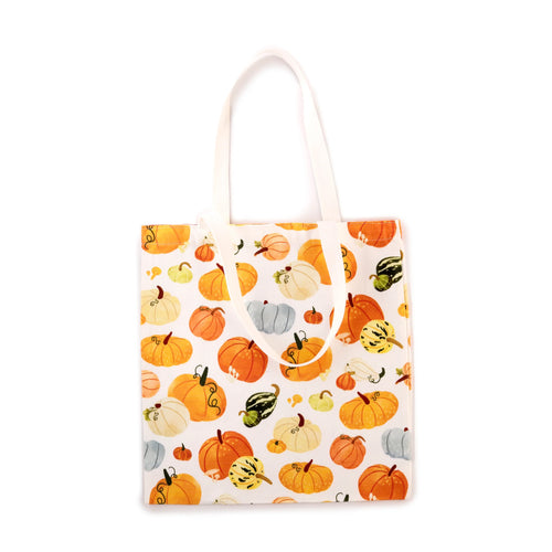 Front view of a white autumnal tote shopping bag patterned with colourful pumpkins and gourds.