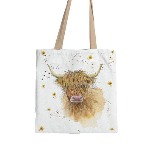 Front view of a white tote shopping bag featuring a watercolour illustration of a shaggy brown Highland coo, accented with yellow flowers and brown splatters.