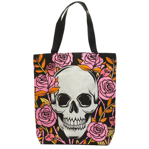 Front view of a black cotton shopping bag featuring a large white skull motif surrounded by pink roses and orange leaves.