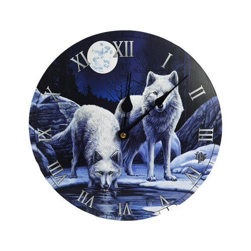 Front view of a circular wall clock featuring a Lisa Parker 'Warriors of Winter' design. The clock face depicts two white wolves in a dark blue, snowy night landscape under a full moon, with bare trees and rocks. It has silver Roman numerals and black clock hands.