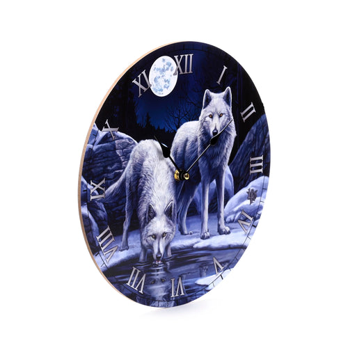 Angled view of a round wall clock, depicting two white wolves in a snowy winter scene under a full moon. One wolf drinks from water, the other stands. The clock face shows Roman numerals and black hands.