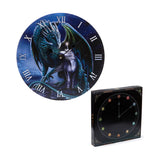 Angled view of a circular wall clock, featuring a blue-green dragon guarding a white unicorn against a dark background, with white Roman numerals and black clock hands. Next to it, a black retail box detailed with a clock face motif and Celtic knot designs.