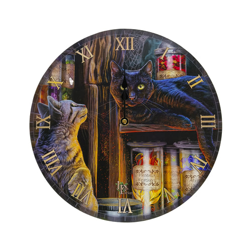 Front view of a round wall clock featuring a magical fantasy illustration. A black cat with green eyes rests on a shelf with jars, whilst a tabby cat looks up from below. The clock face displays gold-coloured Roman numerals and black clock hands.