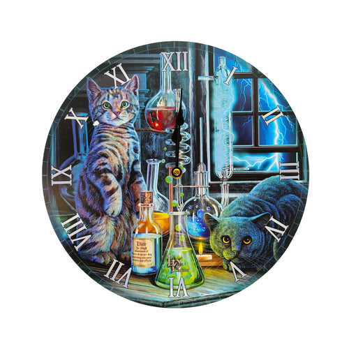 Front view of a circular wall clock, featuring an illustration of a tabby cat and a dark grey cat in a laboratory scene with beakers, colourful liquids, and lightning bolts, all set against a Roman numeral dial with black hands.
