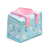 Angled view of a light blue cool bag featuring a vibrant pattern of white unicorns, rainbows, clouds, stars, and hearts, with pink woven fabric handles and a white zip closure.