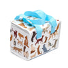 Angled view of a white cool bag with bright blue webbing handles, showing a pattern of diverse stylised cats in brown, cream, grey, and black, with a white zip closure.