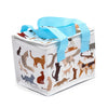 Angled view of a white rectangular cool bag featuring a vibrant, all-over pattern of various illustrated cats in different colours, with light blue fabric carrying handles and a white zip closure.