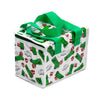 Angled view of a white Minecraft Creeper and TNT cool bag, featuring green pixelated Creeper characters, red TNT blocks, and 'SSS...BOOM' text on its sides and top. It has bright green fabric handles and a dark green zip closure.