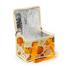 Angled view of an open cream cool bag featuring an autumn pumpkin and gourd pattern, revealing its silver insulated interior, cream zip, and an orange fabric strap.