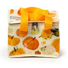 Front view of an Autumn Harvest RPET cool bag, featuring an autumnal pumpkin and gourd pattern on a cream background, with bright orange fabric handles and a double zip closure.