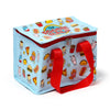 Angled view of a light blue Foodiemals cool bag featuring a colourful cartoon food character pattern, a red zip closure, and red fabric handles.